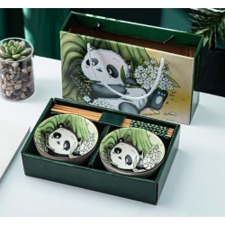 Bols pandas avec deux paires de baguettes